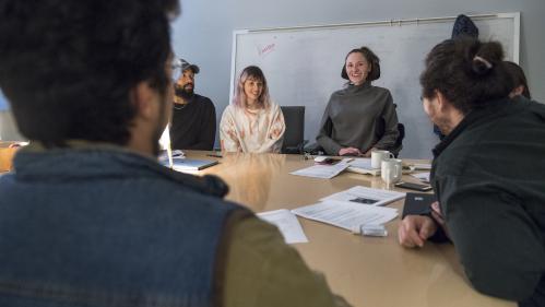 group of people sitting around a table