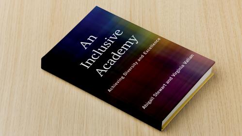 Photo of a book titled "An inclusive Academy" with an abstract rainbow cover
