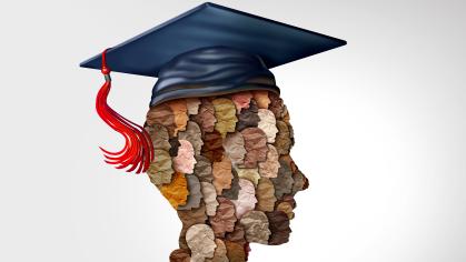 A outline of a head of a student wearing a graduation cap - inside the students head are the side view of hundreds of heads made of different colors of paper