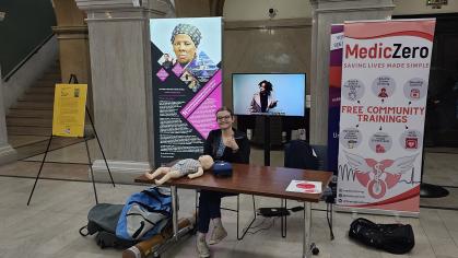 Elizabeth Blizzard, Rutgers New Jersey Medical School student and MedicZero chief clinical officer, at a walk-by Hands-Only CPR training, at the Newark Public Library.