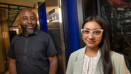 Shikshya Adhikari, research associate at the Center for American Women and Politics, and Travis Williams, senior scientist at the Office of Advanced Research Computing, at the Amarel supercomputer. Nick Romanenko/Rutgers University