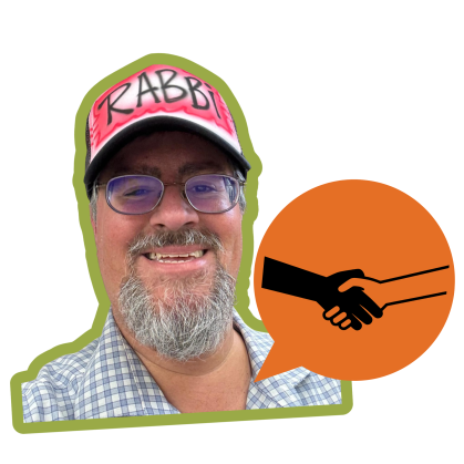 Rabbi Josh Lobel wears a blue and white checked shirt and red cap that says Rabbi. A orange speech bubble with an icon of handshake is in the corner.