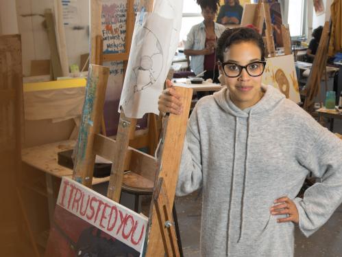 woman standing in an art class