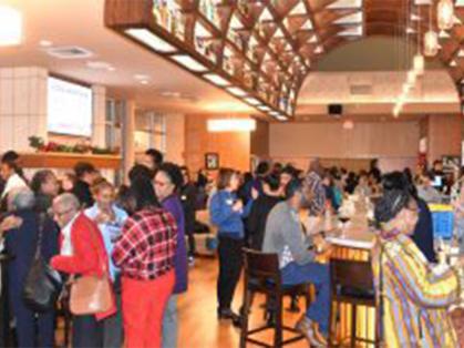 faculty and staff mingle at the Rutgers Club